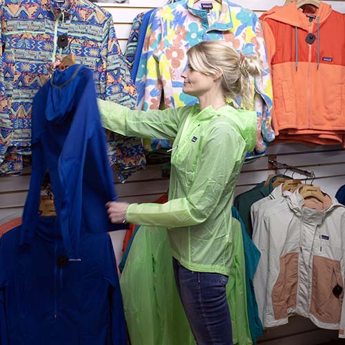 Woman standing in a clothing section of FarmWay