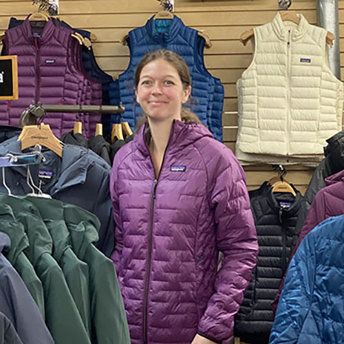 Woman standing in a clothing section of FarmWay