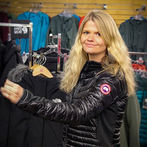 Woman standing in a clothing section of FarmWay